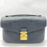 Metis East West Monogram Empreinte Noir