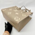 On The Go MM Monogram Empreinte Tourterelle Creme GHW