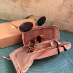 Miu Miu Oval Sunglasses Pale Gold - Dark Blue